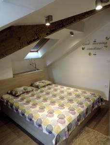 a bedroom with a bed in a attic at Apartment Place 2 Stay in Hvar