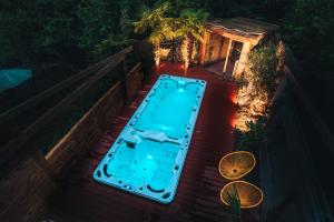 a swimming pool on a deck at night at Hotel Rech in Blansko +71 photos