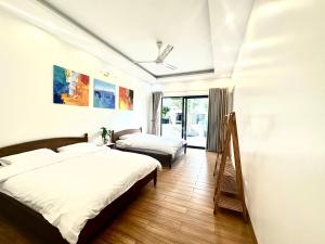 Ένα ή περισσότερα κρεβάτια σε δωμάτιο στο Solmist Villa +50 φωτογραφίες