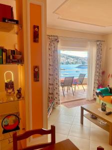 a living room with a view of the ocean at Sea View Apartment in Sarandë