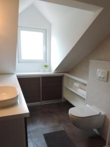 a bathroom with a toilet and a window at Apartment Place 2 Stay in Hvar +27 photos