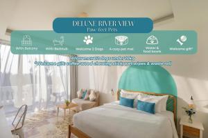 a bedroom with a bed with a green headboard at Moodhoian Riverside Resort & Spa in Hoi An