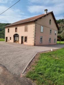 a large house with a driveway in front of it at Chez Remi in Esmoulières