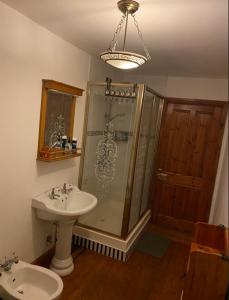 a bathroom with a sink and a shower and a toilet at Room Stay 2 