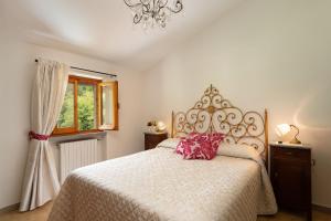 Ένα ή περισσότερα κρεβάτια σε δωμάτιο στο Villa Fornaci +19 φωτογραφίες