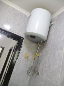 a bathroom with a large white object on the floor at ميرا للشقق المفروشة Mera Apartment in Aqaba +25 photos