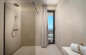 a bathroom with a shower with a glass door at Lovely Home In Primosten With Private Swimming Pool, Can Be Inside Or Outside in Šaričevi +6 photos