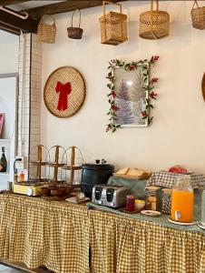 a table with a table cloth on top of it at Silver Oak Valley บ่อเกลือสะปัน น่าน in Ban Kham +28 photos