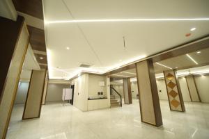 a hallway of a building with a staircase in it at Elight Inn Hotel in Jaipur