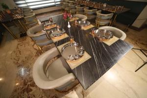 a long table with a bunch of dishes on it at Elight Inn Hotel in Jaipur
