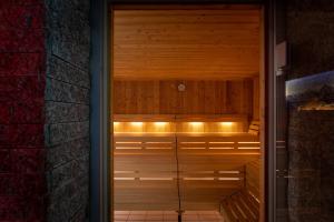 a wooden sauna with lights on top of it at Hotel Victoria Lauberhorn Wengen, a Faern Collection Hotel in Wengen +48 photos