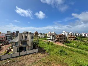 an aerial view of a city with buildings at RK Homes Service Apartments in Sancoale