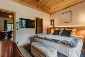 Postel nebo postele na pokoji v ubytování L'Écrin de Megève + 9 fotografií