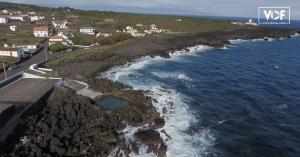 an aerial view of a rocky shoreline with the ocean at Casa da Baía da Manhenha in Manhenha