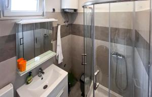 a bathroom with a shower and a sink at Nice Apartment In Duce With House Sea View in Duće
