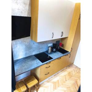 a kitchen with a sink and a counter top at Studio LOFT right in the center in Skorka +12 photos