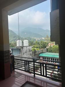 a view from the balcony of a building at Ganpati Guest House Near Ram Jhula in Rishīkesh