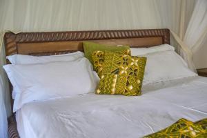 Postel nebo postele na pokoji v ubytování Watamu Vacational Home Ocean Front at Pazuri Villa