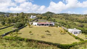 an aerial view of a house with a large yard at Villa Charlotte in Port Mathurin