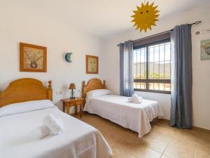 Ένα ή περισσότερα κρεβάτια σε δωμάτιο στο Mahostly Casa de la Roseta B