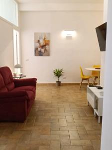 a living room with a couch and a table at Alloggio Turistico Corso Italia 74 Viterbo in Viterbo