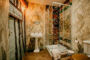 a bathroom with a shower and a sink at Salmestone Grange in Margate +39 photos