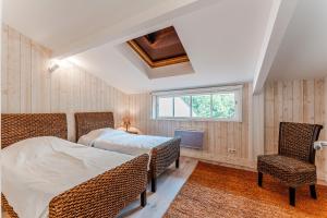 Ένα ή περισσότερα κρεβάτια σε δωμάτιο στο Villa Centre Cap Ferret - Réf 40 +13 φωτογραφίες