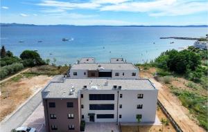 an aerial view of a building near the water at Awesome Apartment In Privlaka With Wifi in Glavan
