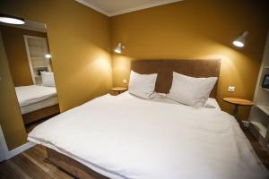 Postel nebo postele na pokoji v ubytování B&B Zum Schleif