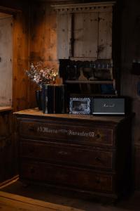 a wooden dresser in a room with at South Tyrol Lodge With Mountain Views in Villandro