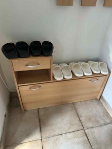a wooden shelf with black bowls on top of it at YCZ Praha in Prague