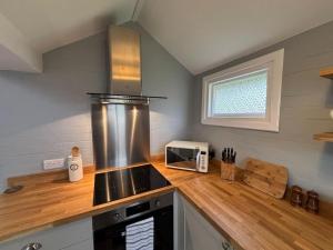 Kuchyň nebo kuchyňský kout v ubytování Old Post Cottage + 6 fotografií
