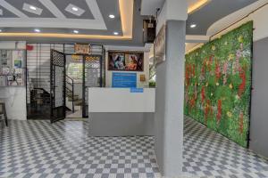 a store with a large painting of flowers on the wall at Quite Room in pune city in Méribel Village