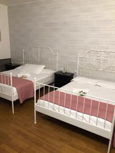 Ένα ή περισσότερα κρεβάτια σε δωμάτιο στο Roberta