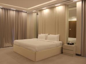 Ένα ή περισσότερα κρεβάτια σε δωμάτιο στο Lavita Villa - Stunning pool villa Ajman +28 φωτογραφίες