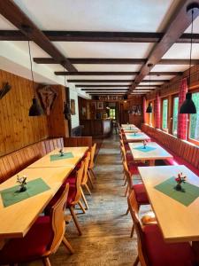 a row of tables and chairs in a restaurant at Essener Skihütte in Willingen