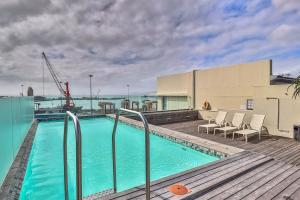 a swimming pool on the roof of a building at Harbour Bridge 401 by CTHA in Cape Town