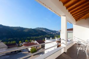 a balcony with a view of the mountains at Outeiro 7 in Penacova