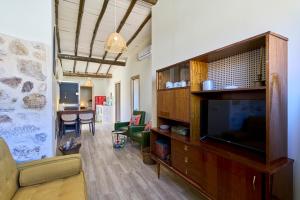 TV a/nebo společenská místnost v ubytování Casa Oliva by gaiarooms
