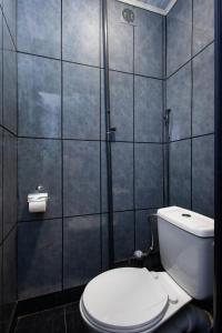 a bathroom with a toilet and a shower at Apartment KeyGo #0191 comfort and coziness in the city in Yerevan +20 photos