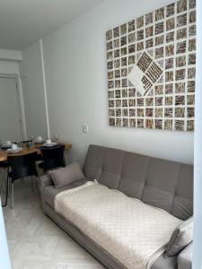 a living room with a couch and a table at LK Centro 1 in Belo Horizonte