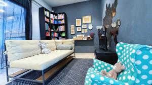 a living room with a couch and two chairs at Bangi Avenue, 43000 Kajang Fully Air-Con Homestay in Kajang