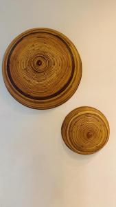 two wooden plates sitting on top of a table at Bangi Avenue, 43000 Kajang Fully Air-Con Homestay in Kajang