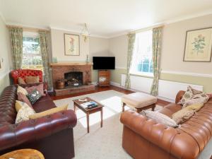 Posezení v ubytování Larkspur Cottage