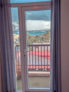 a view of the ocean from a room with a window at DL's crib in Lo-oc