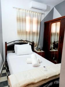 Ένα ή περισσότερα κρεβάτια σε δωμάτιο στο Hadi house