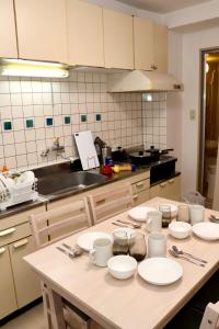 Η κουζίνα ή μικρή κουζίνα στο Casa M hacchobori Stay