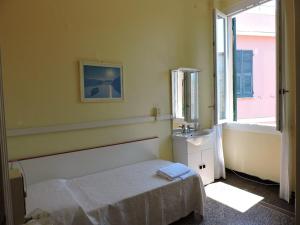 Postel nebo postele na pokoji v ubytování Albergo La Vela