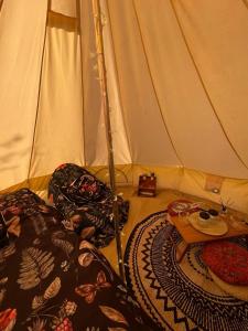 a room with a tent with a table in it at Happy Meadows - Mushroom Street in Long Stratton