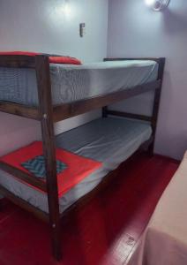 a couple of bunk beds in a room at Duplex En Iguazu in Puerto Iguazú